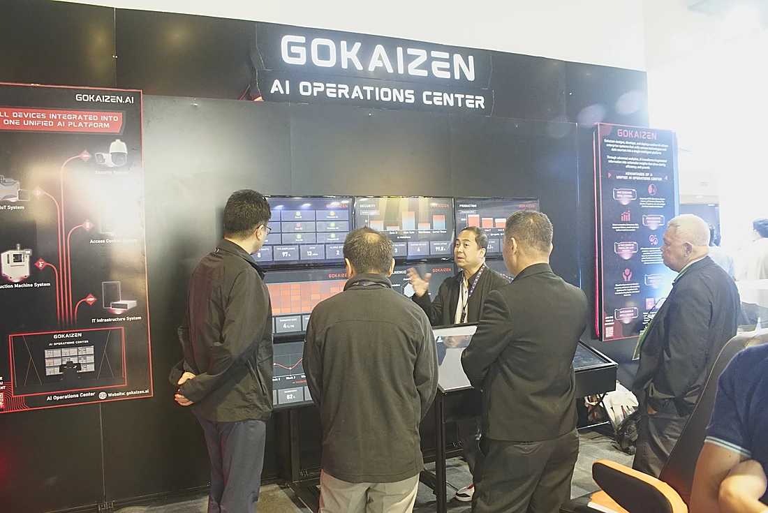 A Gokaizen engineer walking visitors through the AI Operations Center dashboard wall