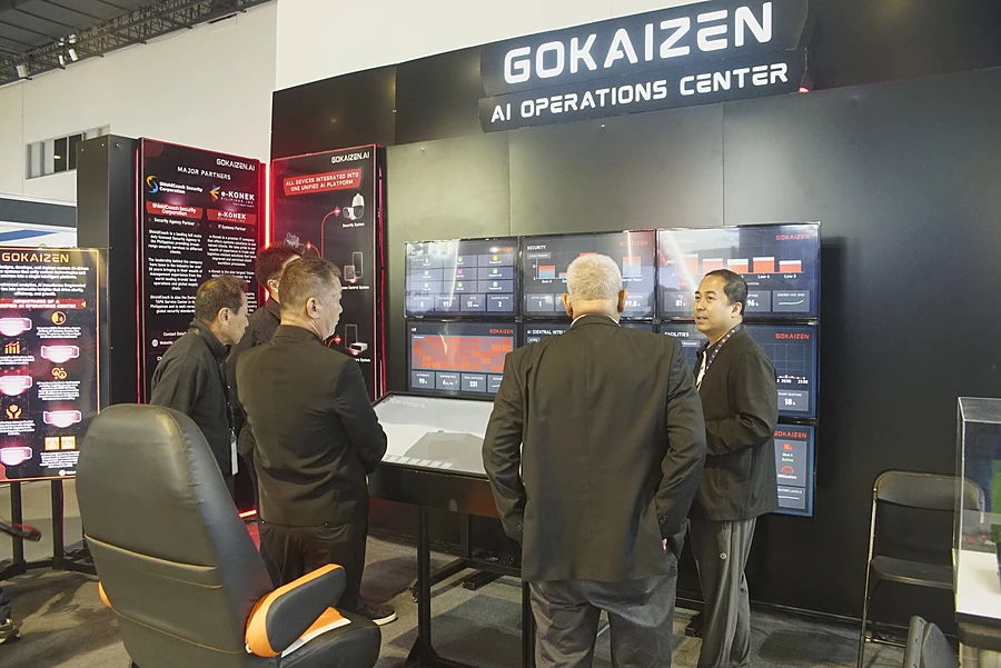 Visitors gathered at the dashboard wall beneath the AI Operations Center sign