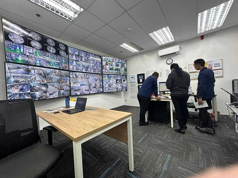 Operators at a manufacturing site control room