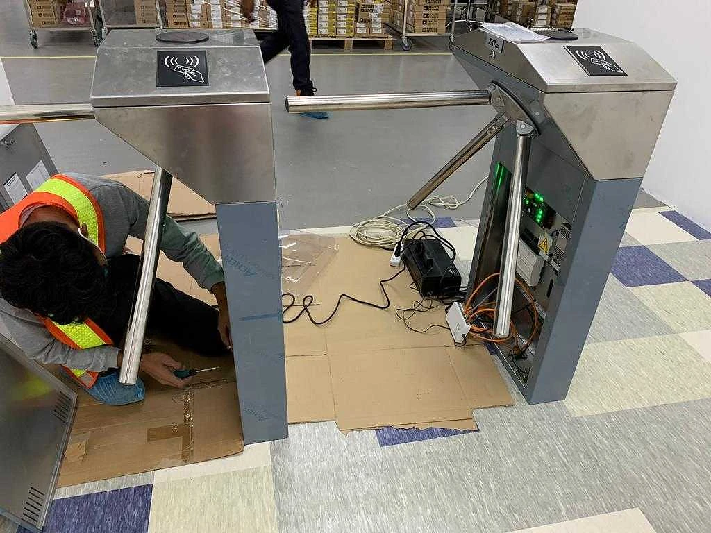 A Gokaizen technician commissioning an access control turnstile on site